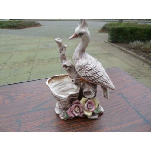 Bloempot met watervogel.