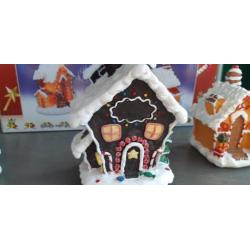 Kerst snoephuisjes met lampjes op stroom