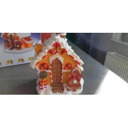 Kerst snoephuisjes met lampjes op stroom