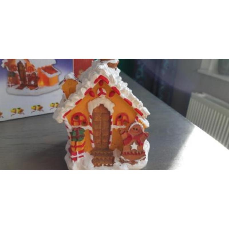 Kerst snoephuisjes met lampjes op stroom