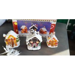 Kerst snoephuisjes met lampjes op stroom